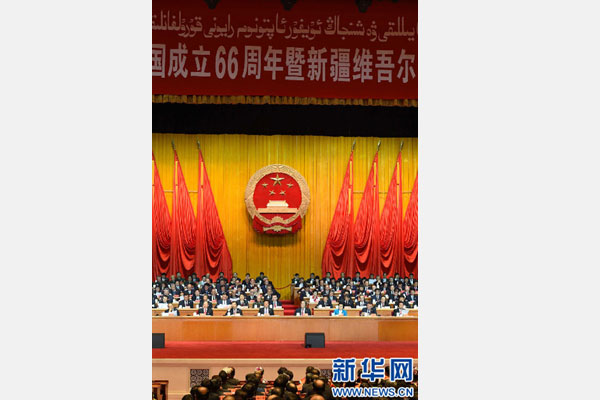 10月1日，慶祝中華人民共和國成立66周年暨新疆維吾爾自治區成立60周年大會在新疆人民會堂隆重舉行。 新華社記者 高潔 攝 