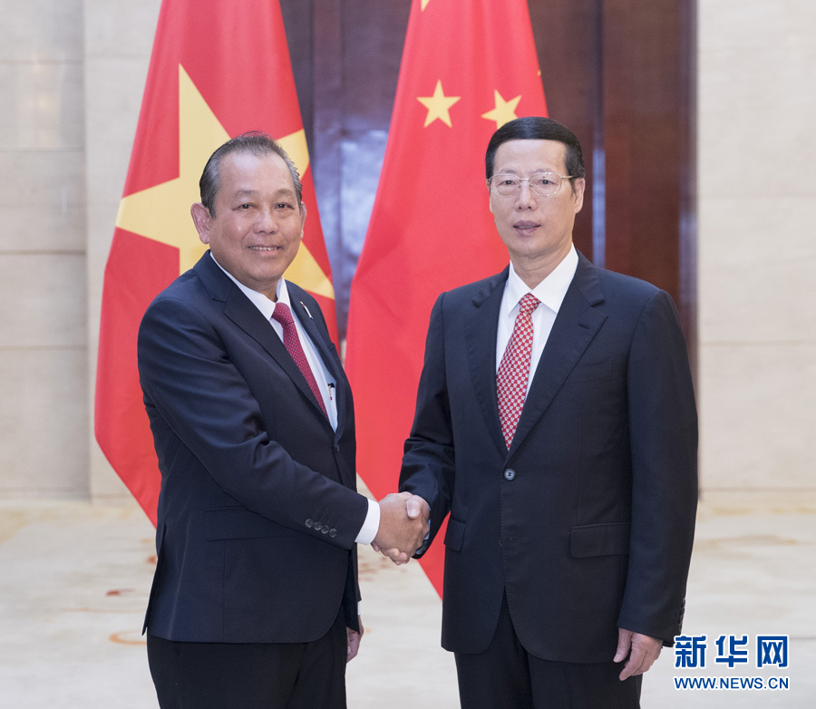  9月11日，中共中央政治局常委、國務院副總理張高麗在廣西南寧會見前來出席第十四屆中國－東盟博覽會和中國－東盟商務與投資峰會的越南常務副總理張和平。新華社記者王曄攝